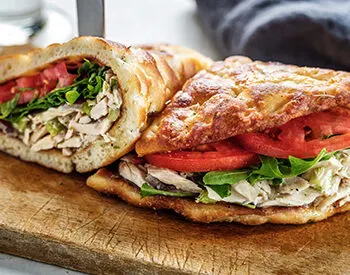 Sandwiches, salads, and a choice of dessert in Anthony’s Lunchbox Package, perfect for catered lunches and gatherings at Anthony’s.