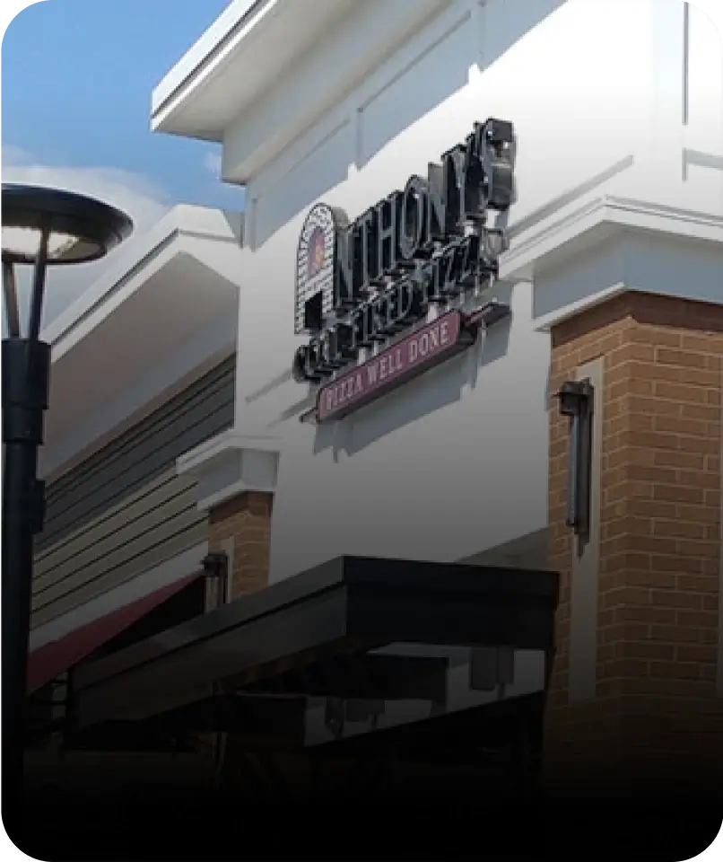 Anthony’s Coal Fired Pizza location in Weston, showcasing the inviting storefront with the recognizable logo on display.