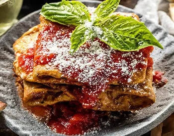Thin-sliced eggplant baked with sauce and cheese on coal fired crust, Anthony’s signature Italian starter before pizza or wings.
