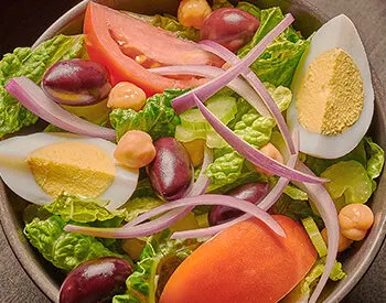 Anthony’s classic Italian salad with crisp greens, olives, tomato, and pepper, served fresh before pizza or pasta.