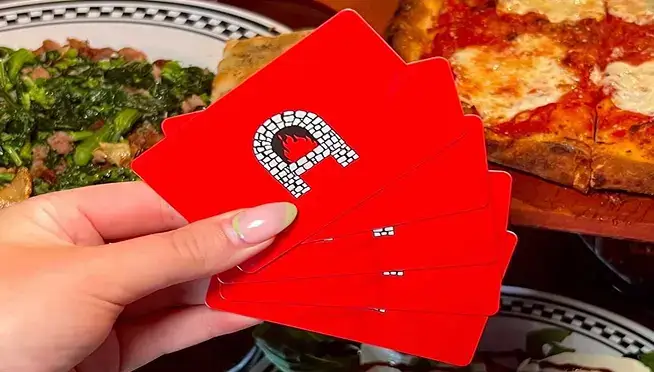 Close-up of Anthony’s Coal Fired Pizza gift cards, an ideal gift for pizza lovers, perfect for pizza takeout or dine-in.
